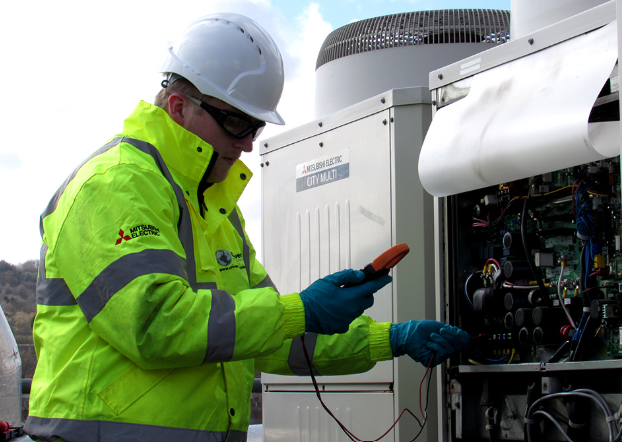 Universal Cooling engineer testing a Mitsubishi Electric City Multi unit under a maintenance contract